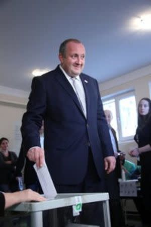 Georgia's President Giorgi Margvelashvili casts his ballot during the parliamentary elections in Tbilisi, Georgia, October 8, 2016. Press Service of Georgian President/Leli Blagonravova/Handout via REUTERS