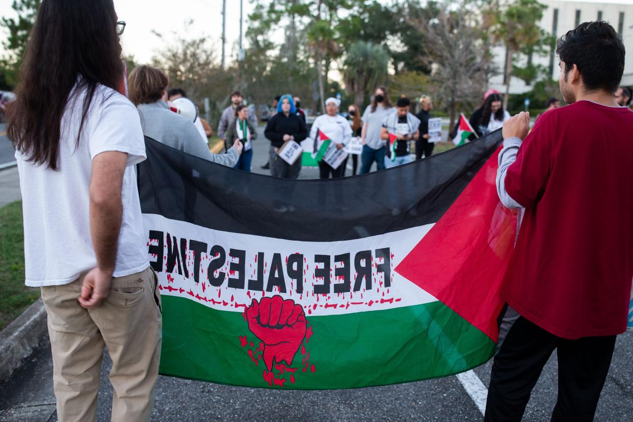 A couple hundred people gathered in a parking lot across from Cascades Park in Tallahassee to show support for Palestinians and protest aid being sent to Israel on Oct. 18, 2023.