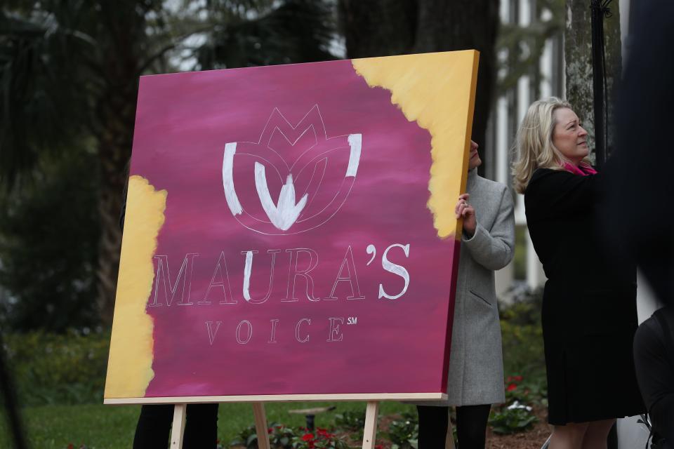 Friends and family were invited to help paint the logo for Maura's Voice at a gathering to celebrate the launch of the foundation created to research and understand the relationship between mental illness, hate and violence in honor of Maura Binkley, a victim of the Friday, Nov. 2, 2018 Tallahassee Hot Yoga shooting.  