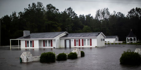 A house is seen flooded by rain after Hurricane Florence swept through the town of Wallace, North Carolina, U.S., September 15, 2018. REUTERS/Eduardo Munoz