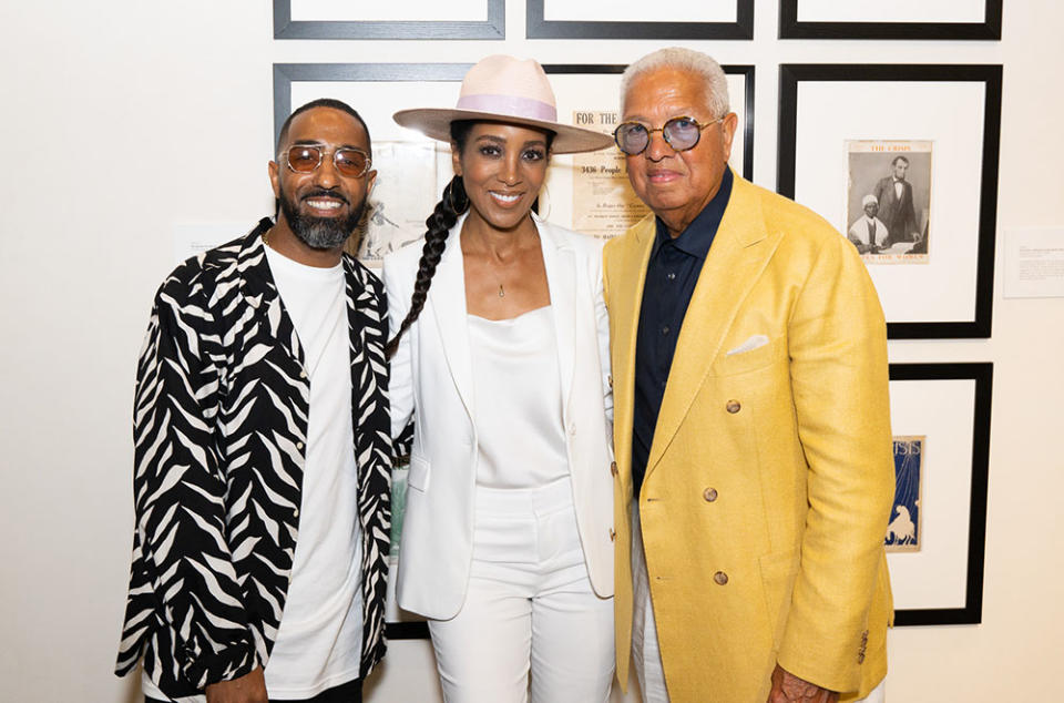 Khalil Kinsey, Shaun Robinson and Bernard Kinsey catch up at the Kinsey African American Art & History Collection opening night at SoFi Stadium on Aug. 25, 2022.