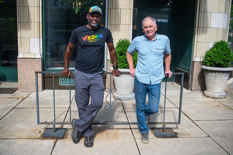 Wedge Brewery manager Lucious Wilson (left) and owner Tim Schaller (right) pose in front of their new location at Grove Arcade on Monday, June 7, 2021.