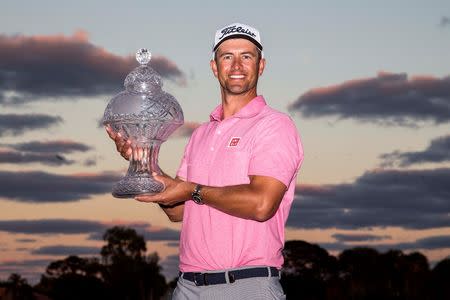 Feb 28, 2016; Palm Beach Gardens, FL, USA; Adam Scott celebrates with the trophy after winning the Honda Classic at PGA National. Mandatory Credit: Peter Casey-USA TODAY Sports