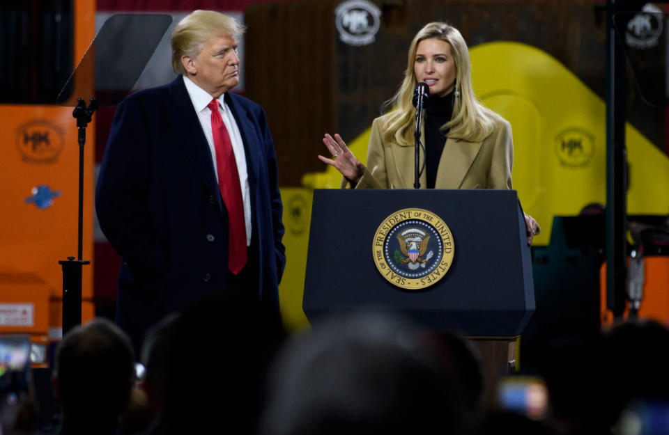 President Donald Trump listens to his daughter Ivanka Trump speak to supporters at a rally on January 18, 2018, in Coraopolis, Pa. (Photo by Jeff Swensen/Getty Images) | Jeff Swensen—Getty Images