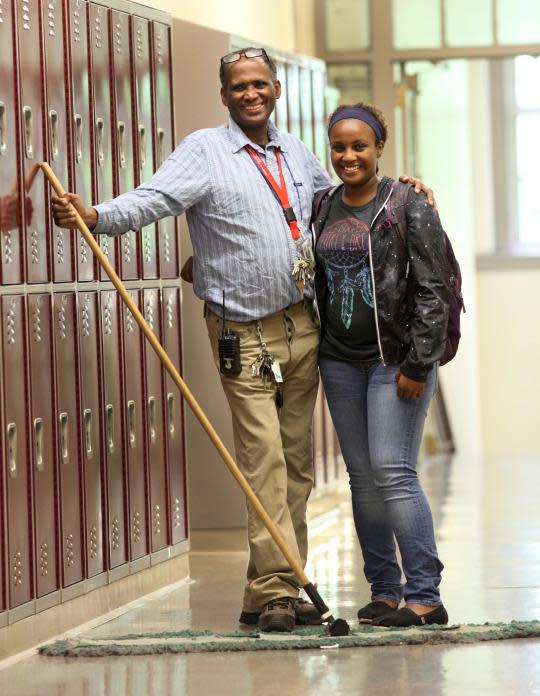 Jamal Abdullahi, a custodian at Wilson Magnet High School, with his daughter Biiftu Duresso, the class valedictorian. (Photo: Max Schulte/Democrat and Chronicle)