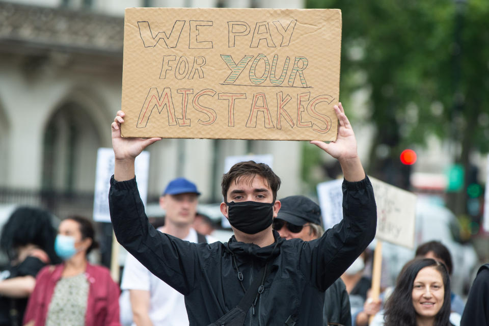 People take part in a protest marching from Downing Street to the Department of Education in Westminster, London, over the government's handling of A-level results. Thousands of pupils across England have expressed their disappointment at having their results downgraded after exams were cancelled due to coronavirus. Picture date: Friday August 14, 2020. Photo credit should read: Matt Crossick/Empics