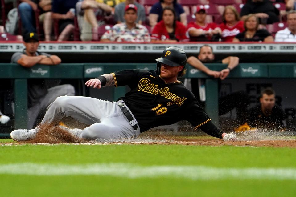 Pittsburgh Pirates left fielder Ben Gamel (18) scores during the third inning of a July 7 game at Cincinnati.