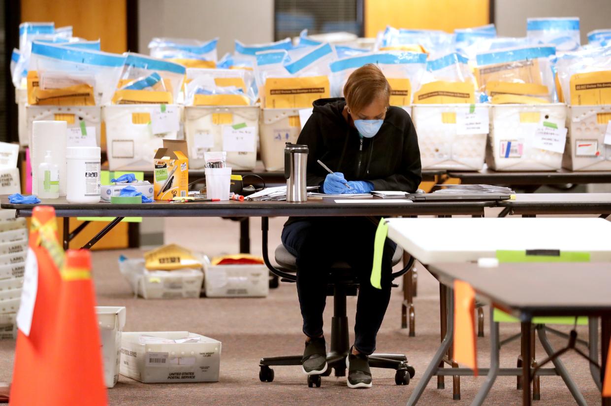 Stephanie Rushing, a election service coordinator with the City of Milwaukee Election Commission counts ballots as City of Milwaukee Election Commission workers were processing absentee ballots on the fourth floor of an office building at 501 W. Michigan Ave. in Milwaukee  on April 13, 2020.