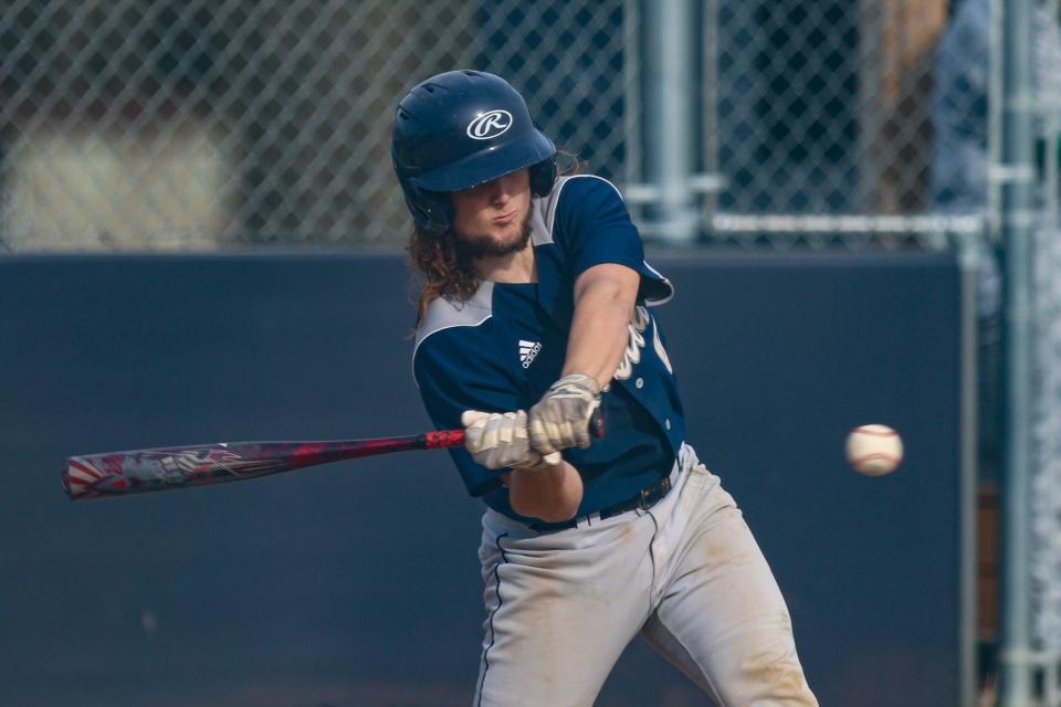 Rootstown senior catcher Jaggar Kokochak connects for a hit during Thursday night's game against the Mogadore Wildcats in Rootstown.