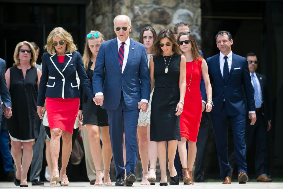 Vice President Joe Biden holds the hands of his wife Dr. Jill Biden (left) and his daughter-in-law Hallie Biden as they arrive for the dedication of his son Beau. The Delaware National Guard honor the late Beau Biden, a former Attorney General, and a Major in the Delaware Army National Guard, by naming the Delaware National Guard Headquarters, located at 250 Airport Road in New Castle, after him. 