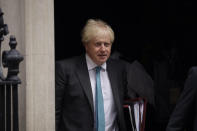 British Prime Minister Boris Johnson leaves 10 Downing Street in London, to attend the weekly Prime Minister's Questions at the Houses of Parliament, in London, Wednesday, Sept. 16, 2020. (AP Photo/Matt Dunham)