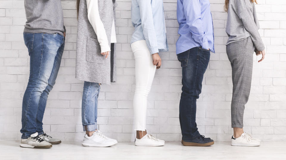 Multi Ethnic People Standing In Row On White Brick Wall Background, Profile