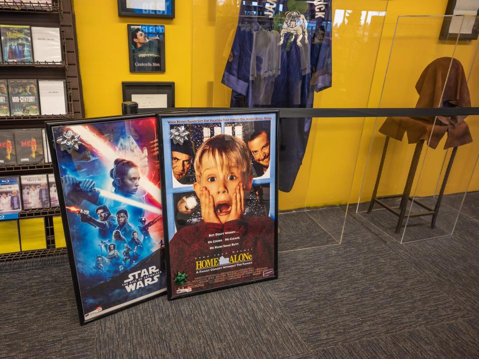 star wars and home alone posters on floor of blockbuster