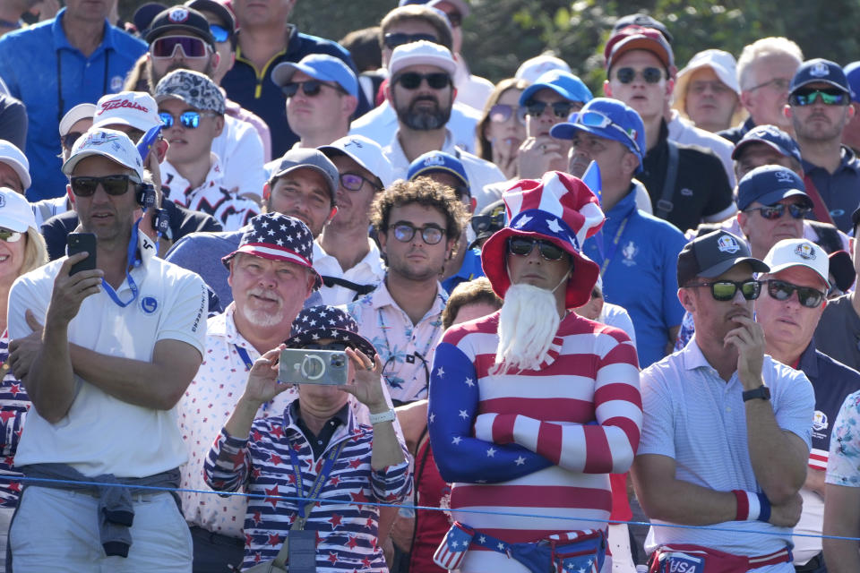 United States fans watch the action on the 15th green during the morning Foursome match at the Ryder Cup golf tournament at the Marco Simone Golf Club in Guidonia Montecelio, Italy, Friday, Sept. 29, 2023. (AP Photo/Gregorio Borgia )