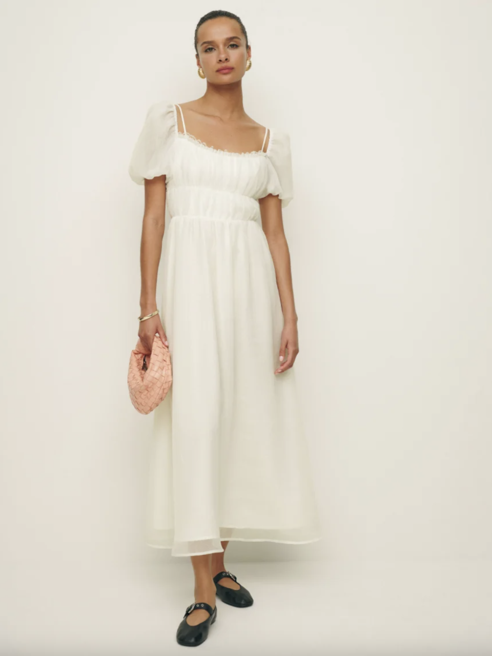 woman wearing white dress and black ballet flats, Mayme Dress (Photo via Reformation)