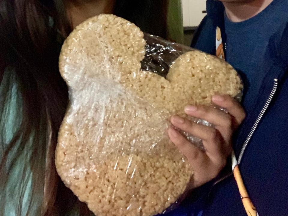 saira and friend with a huge marshmallow treat at disney world