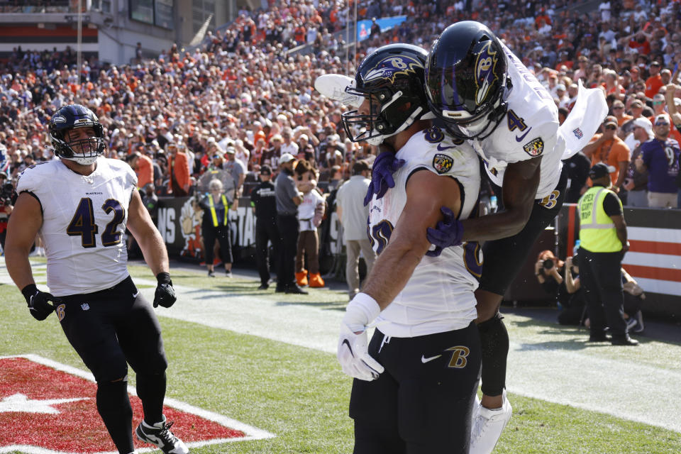 Baltimore Ravens tight end Mark Andrews, center, celebrates with Baltimore Ravens wide receiver Zay Flowers, right, after scoring a 7-yard touchdown during the first half of an NFL football game against the Cleveland Browns, Sunday, Oct. 1, 2023, in Cleveland. (AP Photo/Ron Schwane.)