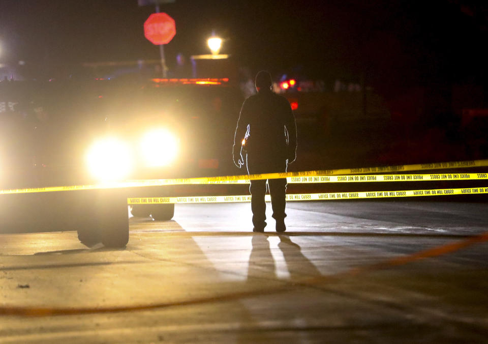 Police investigate after four people were killed and fifth person was injured in a shooting at a Grantsville, Utah, home Friday, Jan. 17, 2020. The suspected shooter was taken into custody by Grantsville police, the Deseret News reported. Grantsville Mayor Brent Marshall said the victims and the shooter are all related, the newspaper reported. (Steve Griffin/The Deseret News via AP)