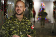 Canadian Armed Forces Major Andrew Hennessy, of Armstrong, B.C., talks about the volunteer effort in the NORAD Tracks Santa center at Peterson Air Force Base, Monday, Dec. 23, 2019, in Colorado Springs, Colo. More than 1,500 volunteers will answer an estimated 140,000 telephone inquiries to learn of the whereabouts of Santa Claus on Christmas Eve. (AP Photo/David Zalubowski)