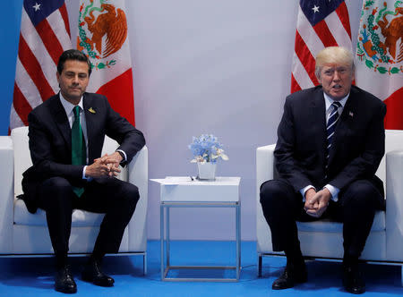 FILE PHOTO: U.S. President Donald Trump meets Mexico's President Enrique Pena Nieto during the their bilateral meeting at the G20 summit in Hamburg, Germany July 7, 2017. REUTERS/Carlos Barria