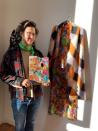 Milan-based Austrian fashion designer Arthur Arbesser, poses in his studio holding a painter’s pallet that he picked up at a flea market, and which inspired the signature print for his Fall 2021 collection of 25 looks, in Milan, Italy, Sunday, Feb. 28, 2021. Arbesser decided against a runway show in this digital era, instead focusing his creative energies to make a collection from revitalized textiles from his archives that he had printed over, and experimenting with other artisanal techniques with his small team. (AP Photo/Colleen Barry)