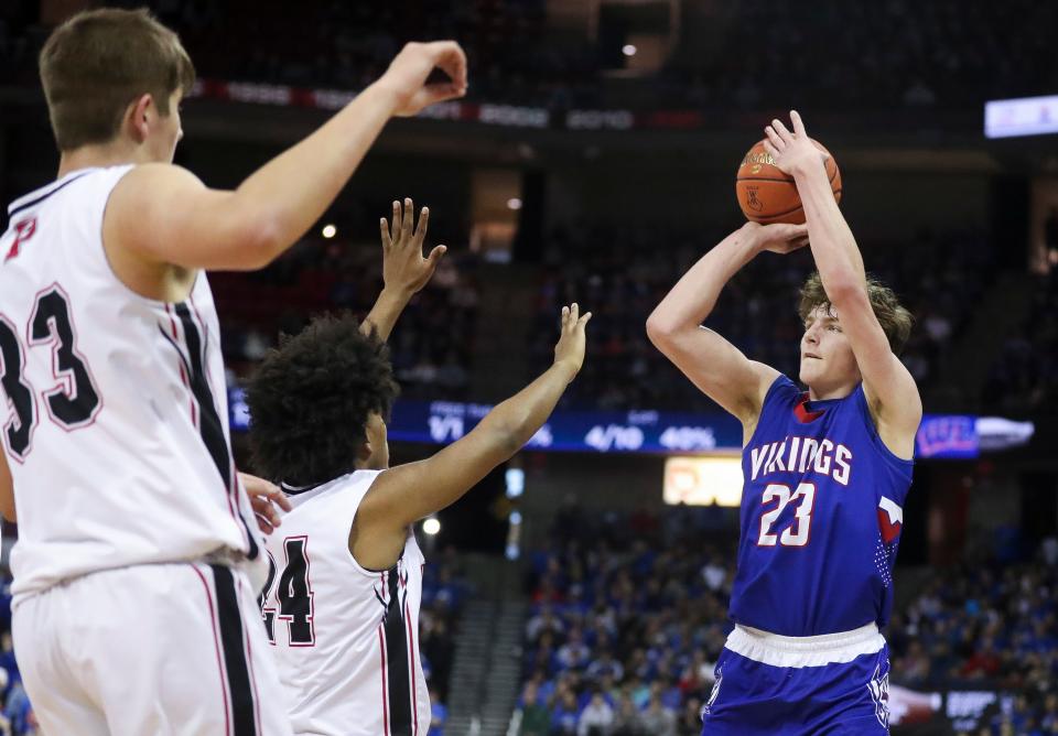 Wisconsin Lutheran's Zavier Zens shoots a three-pointer against Pewaukee in the Division 2 state championship game Saturday night at the Kohl Center. The sophomore scored 16 points.