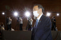 Yoshihide Suga arrives at the prime minister's office after being formally elected Japan’s prime minister in a parliamentary vote in Tokyo Wednesday, Sept. 16, 2020. (Shinji Kita/Kyodo News via AP)