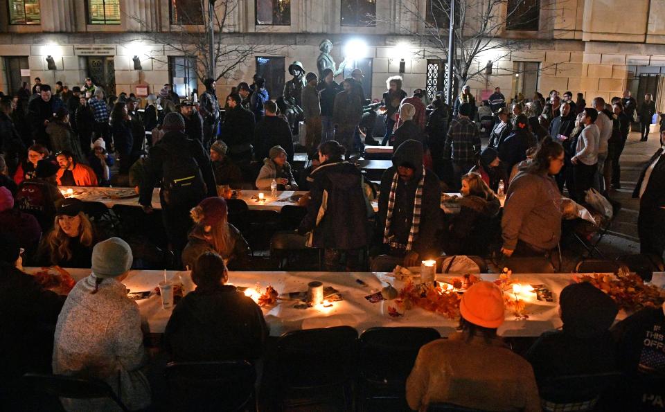 Residents sit in preparation for dinner as the Monday night program (People Loving Nashville) provides free meals for the homeless. Monday, Nov. 25, 2019, in Nashville, Tenn. 