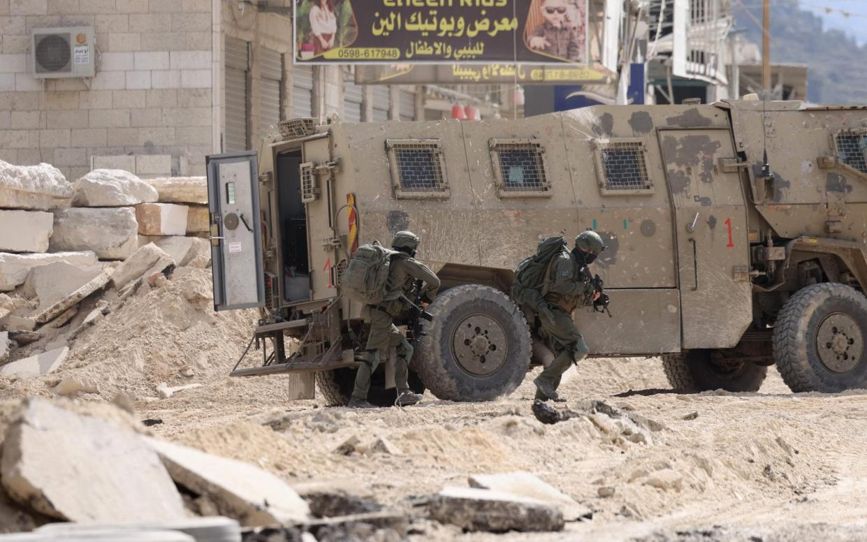 Israeli soldiers operate during a raid in the Nur Shams camp for Palestinian refugees near the city of Tulkarem