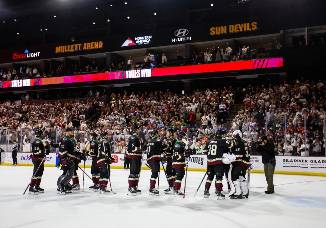 Arizona Coyotes players celebrate together on the ice after defeating the Edmonton Oilers 5-2 at Mullett Arena. The game was the franchise's last in Arizona before it relocates to Salt Lake City.