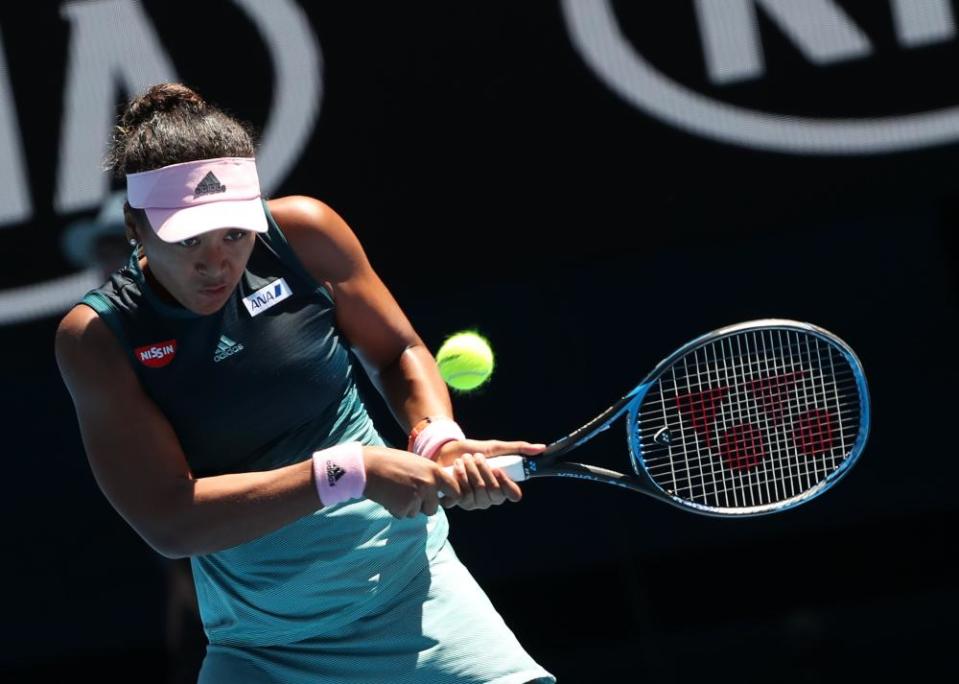 Naomi Osaka of Japan returns the ball against Elina Svitolina of Ukraine.