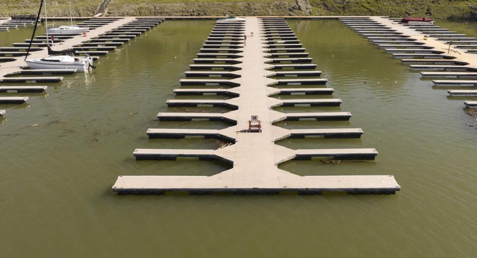 Docks float in the Browns Ravine Cove area of Folsom Lake in Folsom, Calif., Sunday, March 26, 2023. Months of winter storms have replenished California’s key reservoirs after three years of punishing drought. (AP Photo/Josh Edelson)