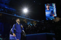 FILE - Serbia's Novak Djokovic enters the field of play prior to play against Norways' Casper Ruud during their ATP World Tour Finals singles tennis match, at the Pala Alpitour in Turin, Nov. 15, 2021. The Australian government has denied No. 1-ranked Djokovic entry to defend his title in the year's first tennis major and canceled his visa because he failed to meet the requirements for an exemption to the country's COVID-19 vaccination rules. (AP Photo/Luca Bruno, File)