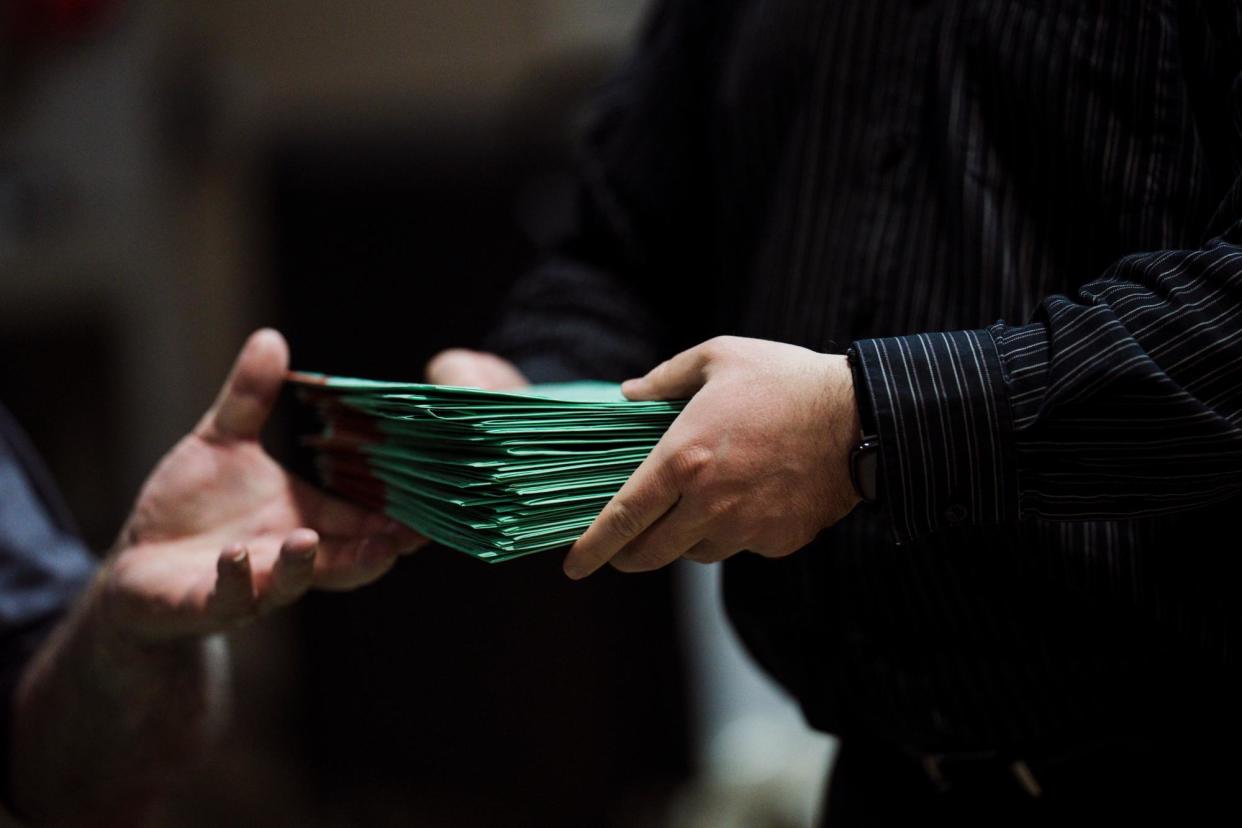 <span>Election workers sort mail in ballots in Maricopa county in Phoenix, Arizona, on 8 November 2022.</span><span>Photograph: Eric Thayer for The Washington Post via Getty Images</span>