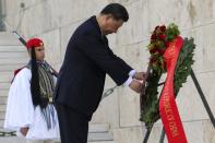 Chinese President Xi Jinping lays a wreath at the tomb of the unknown soldier in Athens, Monday, Nov.11, 2019. Xi is meeting political leaders in Greece on Monday as part of a trip aimed at furthering a major global investment initiative inside the European Union. (Giorgos Zachos/InTime News via AP)