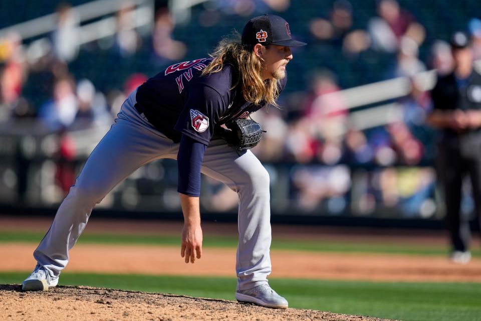 Cleveland Guardians pitcher Nick Mikolajchak waits for a signal in the eighth inning of the MLB Cactus League spring training game between the Cincinnati Reds and the Cleveland Guardians at Goodyear Ballpark in Goodyear, Ariz., on Saturday, Feb. 25, 2023.