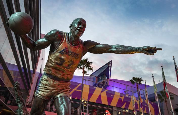 A statue of Magic Johnson resides outside Crypto.com Arena in downtown Los Angeles.