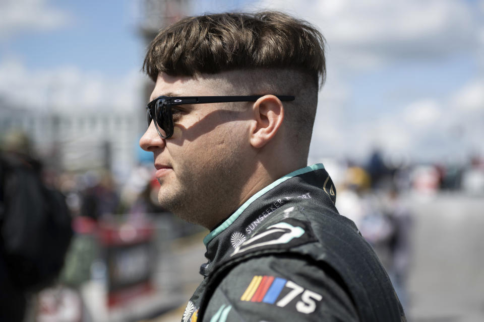 Noah Gragson watches before the start of the NASCAR 400 auto race at Dover Motor Speedway Monday, May 1, 2023, in Dover, Del. (AP Photo/Jason Minto)