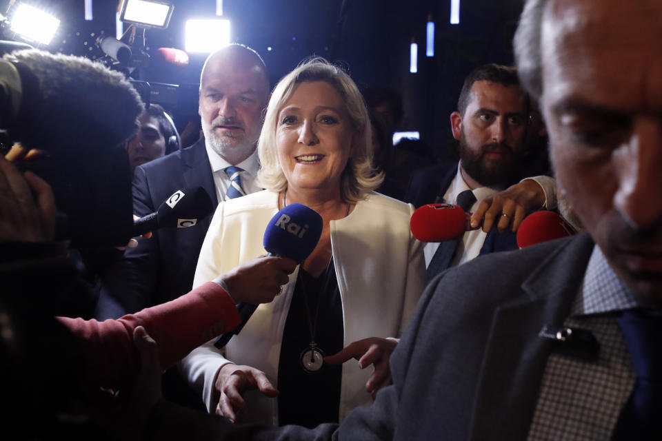 Far-right National Party leader Marine le Pen leaves after delivering a speech at the campaign headquarters, Sunday, May 26, 2019 in Paris. Le Pen declared victory in the European Parliament election over pro-EU French President Emmanuel Macron. (AP Photo/Thibault Camus)