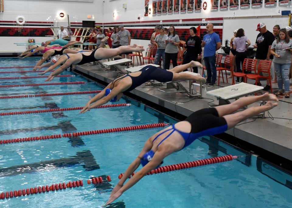 Off the blocks in the 50 yard freestyle race, the winner from Milan Annabelle Williams in the Monroe County Swim Finals Saturday. From the bottom to top; Natalie Bron of Dundee, Elana Williams of Dundee, Kiera Luhrs of Milan, Madison Walker of Bedford, Annabelle Williams of Milan, Lia Parry of Dundee, Lily Landolt of Bedford and Monika Burkardt of SMCC.