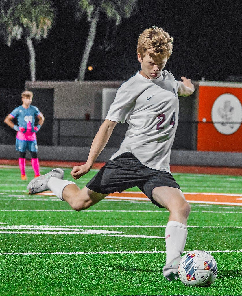 Braden River High boys soccer junior Kyle Langley take a free kick against Sarasota High. Langley has been one of the key players on defense for the Pirates.
