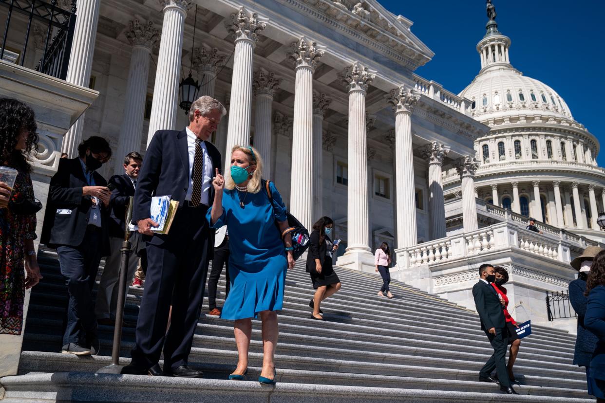 Rep. Debbie Dingell (D-MI) tells Rep. Marjorie Taylor Greene (R-Ga.) to be respectful of her neighbors ahead of a photo opportunity on the steps of the House of Representatives at the U.S. Capitol in Washington, D.C. on Friday, Sept. 24, 2021.