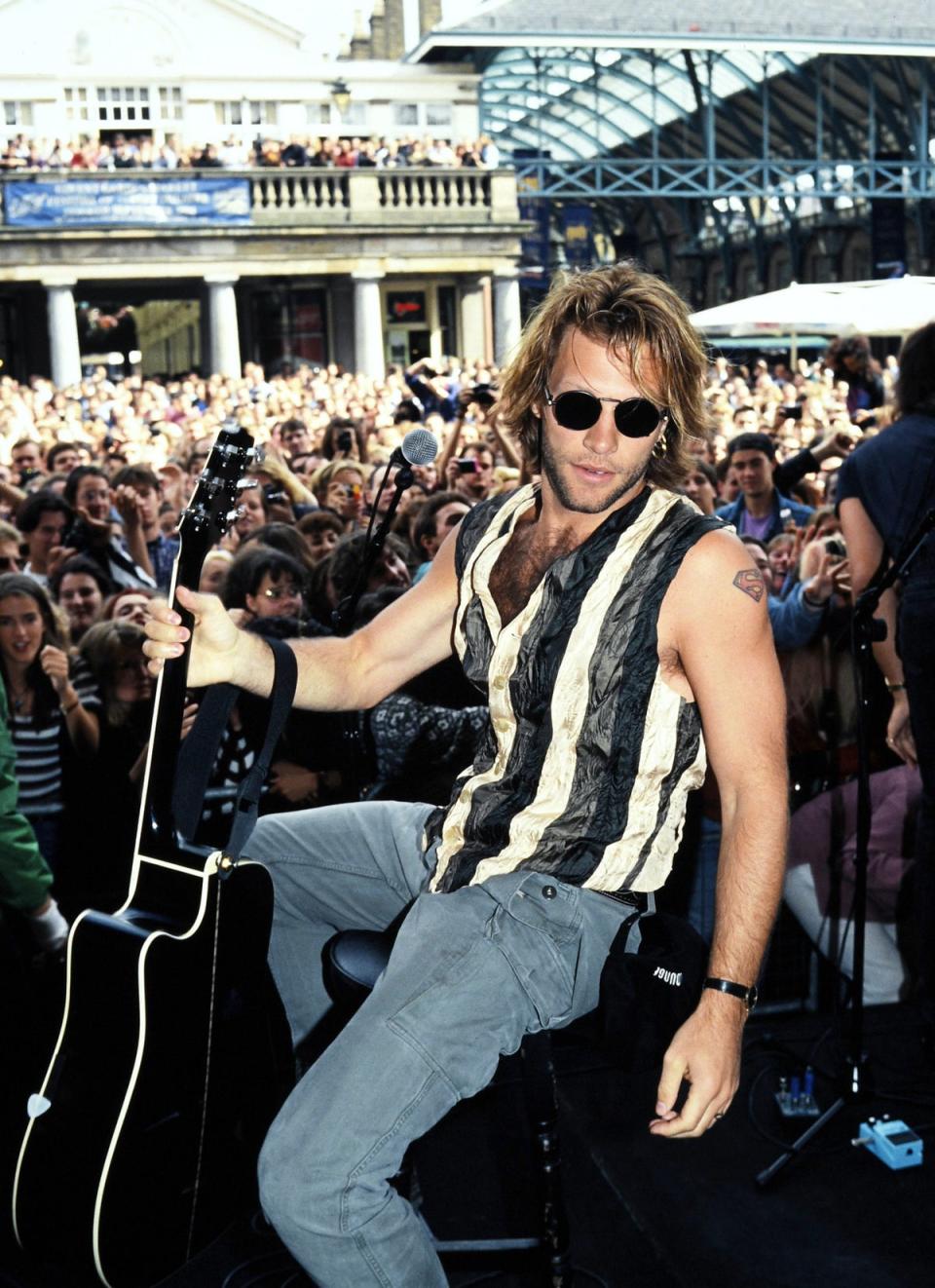 Jon Bon Jovi performs to a throng of fans in Covent Garden, London in 1994 (Shutterstock)