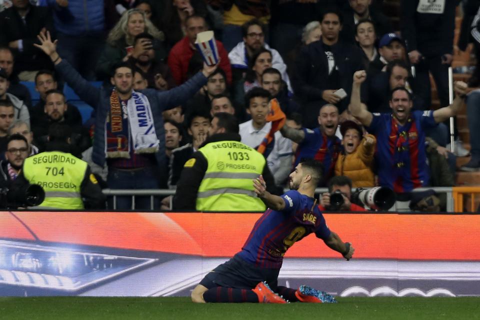 Barcelona forward Luis Suarez celebrates after scoring the opening goal of his team during the Copa del Rey semifinal second leg soccer match between Real Madrid and FC Barcelona at the Bernabeu stadium in Madrid, Wednesday, Feb. 27, 2019. (AP Photo/Manu Fernandez)