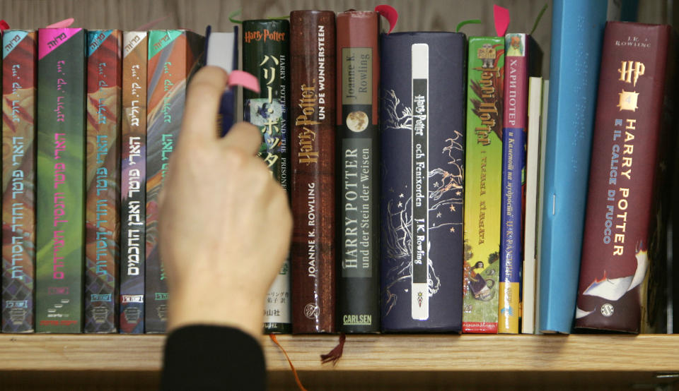 Books that make up part of an auction lot containing 550 international copies of works in the Harry Potter series are seen on a shelf at Bloomsbury Auctions in London February 26, 2008. Described as an 'extraordinary collection' of a private collector, it contains 67 different languages with some first edition and rare proof copies, will be auctioned this Thursday.       REUTERS/Luke MacGregor   (BRITAIN)