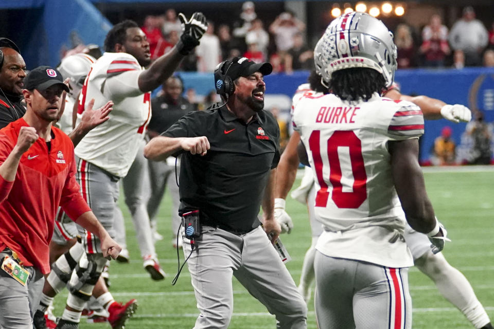 FILE - Ohio State head coach Ryan Day celebrates stoping Georgia on fourth down during the second half of the Peach Bowl NCAA college football semifinal playoff game, Saturday, Dec. 31, 2022, in Atlanta. Ohio State is No. 3 in The Associated Press preseason Top 25 poll released Monday, Aug. 14, 2023. (AP Photo/John Bazemore, File)