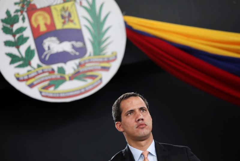 Venezuela's National Assembly President and opposition leader Juan Guaido, who many nations have recognised as the country's rightful interim ruler, attends a session of Venezuela's National Assembly taking place in an amphitheatre in Caracas