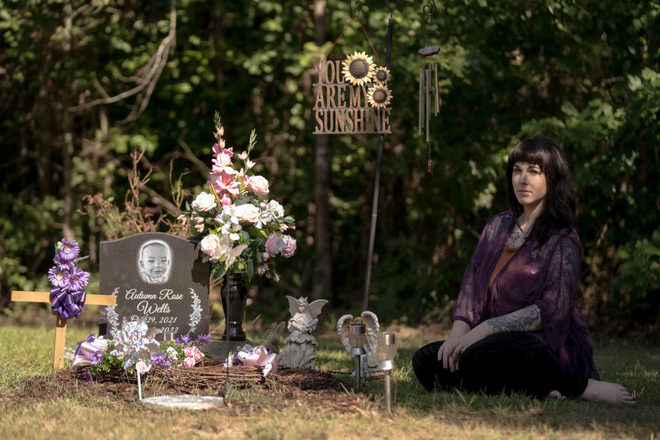 Autumn Wells' mother Taylor Wells at her daughter’s final resting place at the family cemetery plot in Belmont, Miss., on July 30, 2023. (Andrea Morales for NBC News)