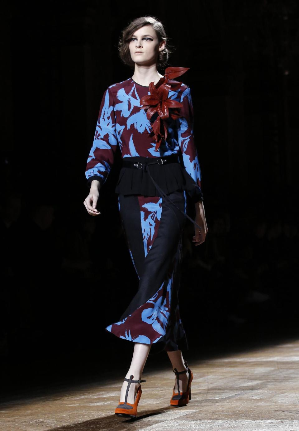 A model wears a creation for Dries van Noten's ready-to-wear fall/winter 2014-2015 fashion collection presented in Paris, Wednesday, Feb.26, 2014. (AP Photo/Jerome Delay)