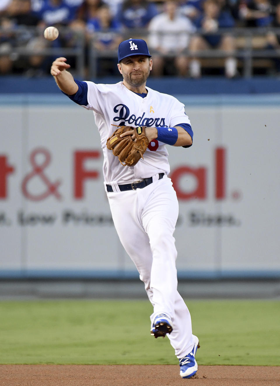 Los Angeles Dodgers second baseman Brian Dozier throws to first base after fielding a grounder by Arizona Diamondbacks' Paul Goldschmidt during the first inning of a baseball game, Saturday, Sept. 1, 2018, in Los Angeles. (AP Photo/Michael Owen Baker)